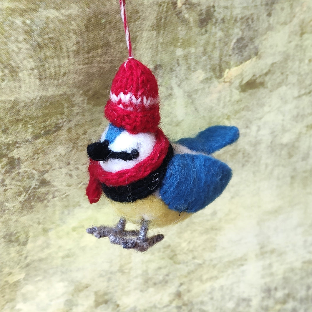 Felt Blue Tit Christmas tree decoration with red bobble hat and scarf. Fair Trade. Hand made in Nepal for Namaste