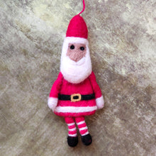 Red felt Santa with striped stockings Christmas tree decoration hand made in Nepal under Fair Trade conditions for Namaste.