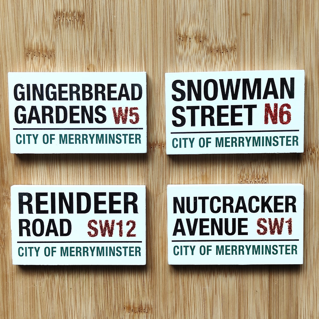 Four Christmas-themed street signs by Heaven Sends