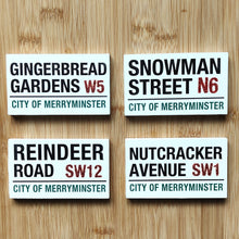 Four Christmas-themed street signs by Heaven Sends