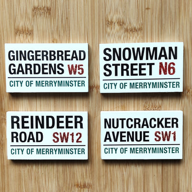 Four Christmas-themed street signs by Heaven Sends