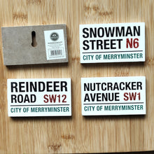 Four Christmas-themed street signs by Heaven Sends